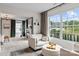 Comfortable living room with large windows, stylish seating, and serene views at 106 Wrangler Dr, Mooresville, NC 28115