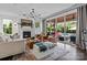 Inviting living room with a fireplace, comfortable seating, and access to a patio with a pool at 106 Wrangler Dr, Mooresville, NC 28115