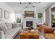Inviting living room with fireplace, comfortable seating, and elegant decor at 106 Wrangler Dr, Mooresville, NC 28115