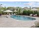 Stunning pool with lounge seating, sun umbrellas, and well-manicured landscaping at 106 Wrangler Dr, Mooresville, NC 28115