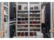 Organized walk-in closet featuring shelving for shoe and accessory storage at 106 Wrangler Dr, Mooresville, NC 28115