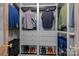 Organized closet with shelving, drawers, and hanging storage for clothes and shoes at 106 Wrangler Dr, Mooresville, NC 28115