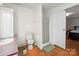 Simple bathroom featuring a toilet, shower, and vanity with wood-look flooring at 1106 3Rd Sw Ave, Hickory, NC 28602