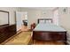Cozy bedroom with a plush bed, dark furniture and an area rug at 1106 3Rd Sw Ave, Hickory, NC 28602