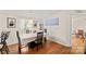 Traditional dining room with wood floors, a white hutch and modern art on the walls at 1106 3Rd Sw Ave, Hickory, NC 28602