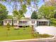 Charming one-story home with red shutters, front porch and fenced yard on a landscaped lot at 1106 3Rd Sw Ave, Hickory, NC 28602