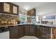 Kitchen showcasing backsplash, stainless steel sink, drawers, cabinets and view of dining room at 1106 3Rd Sw Ave, Hickory, NC 28602
