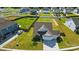 Aerial view of a home with a well-manicured lawn and fenced backyard in a residential neighborhood at 1116 Brooksland Pl, Waxhaw, NC 28173