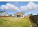 Spacious backyard with a screened-in porch and a well-maintained lawn, perfect for outdoor activities at 1116 Brooksland Pl, Waxhaw, NC 28173