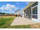 Backyard view featuring a screened porch and patio area, perfect for outdoor entertaining and relaxation at 1116 Brooksland Pl, Waxhaw, NC 28173