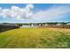 Lush green backyard, bordered by fences, offering ample space for recreation and privacy at 1116 Brooksland Pl, Waxhaw, NC 28173