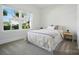 Bright bedroom with large window and a neutral color scheme, bathed in natural light at 1116 Brooksland Pl, Waxhaw, NC 28173