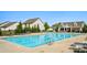 Inviting community pool with ample seating and a nearby clubhouse, ideal for recreation and socializing at 1116 Brooksland Pl, Waxhaw, NC 28173