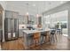 Modern kitchen with stainless steel appliances, gray cabinets and a marble island at 1116 Brooksland Pl, Waxhaw, NC 28173