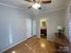 Bedroom with wood flooring, white walls, and an ensuite bathroom at 116 Dove Ln, New London, NC 28127