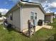 Siding of the home with utilities and a grill at 116 Dove Ln, New London, NC 28127