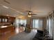 Open-concept living space featuring the living room, dining area, and kitchen with a peninsula at 116 Dove Ln, New London, NC 28127