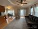Spacious living area with dining area and large windows for natural light and outside views at 116 Dove Ln, New London, NC 28127