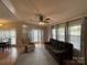 Spacious living room with a ceiling fan, nice furniture, and abundant natural light at 116 Dove Ln, New London, NC 28127