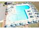 Aerial view of a large community pool with lounge chairs and umbrellas, perfect for summer days at 116 Dove Ln, New London, NC 28127