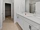 Elegant bathroom with double sinks, quartz countertops, and a glass-enclosed shower at 11933 Silverheel Ln, Huntersville, NC 28078