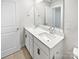 Bathroom featuring double sinks with a white countertop and modern black hardware at 11933 Silverheel Ln, Huntersville, NC 28078
