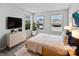 Serene bedroom with natural light, neutral decor, and ample closet space at 11933 Silverheel Ln, Huntersville, NC 28078