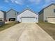 Detached two-car garage with a long driveway and ample parking space at 11933 Silverheel Ln, Huntersville, NC 28078