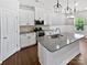 Modern kitchen featuring an island, stainless steel appliances, and custom cabinetry at 11933 Silverheel Ln, Huntersville, NC 28078