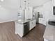 Contemporary kitchen featuring stainless steel appliances and a large island with a sink at 11933 Silverheel Ln, Huntersville, NC 28078