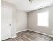 Well-lit bedroom with a window and wood-look flooring with a closet at 1204 Glenarden Dr, Rock Hill, SC 29730