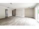 Open living area with light gray walls, wood-look flooring, and a decorative white brick fireplace at 1204 Glenarden Dr, Rock Hill, SC 29730