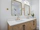 Bright bathroom features double sink vanity with chevron pattern, gold faucets, and walk-in shower at 122 Laura Rd # A, Mooresville, NC 28117