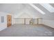 Large bonus room has carpet flooring, skylights, recessed lighting, railing, and neutral paint at 122 Laura Rd # A, Mooresville, NC 28117