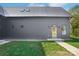 Beautifully designed home with metal roof, modern door, and well-maintained lawn at 122 Laura Rd # A, Mooresville, NC 28117
