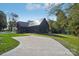 Stunning modern home with metal roof, expansive driveway, and lush green lawn at 122 Laura Rd # A, Mooresville, NC 28117
