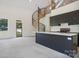 Modern kitchen and living area with spiral staircase and abundant natural light at 122 Laura Rd # A, Mooresville, NC 28117