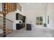 Open-concept living room featuring modern kitchen, spiral staircase, and natural light at 122 Laura Rd # A, Mooresville, NC 28117