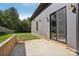 A view of the backyard featuring a small patio area with sliding glass doors leading into the home at 122 Laura Rd # B, Mooresville, NC 28117