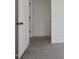 An open doorway leads to other parts of a bedroom with bright white walls and neutral floors at 122 Laura Rd # B, Mooresville, NC 28117