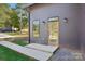 Modern home featuring a glass front door with sidelight window and minimalist landscaping at 122 Laura Rd # B, Mooresville, NC 28117