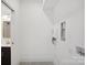A bright laundry room is all white and features neutral countertops and fixtures at 122 Laura Rd # B, Mooresville, NC 28117