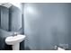 Modern powder room featuring a pedestal sink, chrome fixtures, and contemporary decor at 13408 Portside Ln, Lancaster, SC 29720