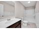 Bright bathroom featuring a single vanity, tub with shower, and neutral paint at 13408 Portside Ln, Lancaster, SC 29720
