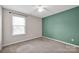 Carpeted bedroom with ample natural light, ceiling fan, and closet at 13408 Portside Ln, Lancaster, SC 29720