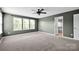 Large bedroom with lots of natural light, a ceiling fan, and a view into the bathroom at 13408 Portside Ln, Lancaster, SC 29720