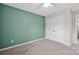 Comfortable bedroom with neutral carpet and a spacious closet at 13408 Portside Ln, Lancaster, SC 29720