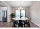 Elegant dining room with hardwood floors, modern lighting, and a view to the kitchen at 13408 Portside Ln, Lancaster, SC 29720