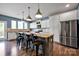 Modern kitchen featuring stainless steel appliances, granite countertops, and a large island at 13408 Portside Ln, Lancaster, SC 29720