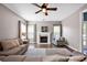 Cozy living room features a fireplace, large windows, and comfortable seating at 13408 Portside Ln, Lancaster, SC 29720